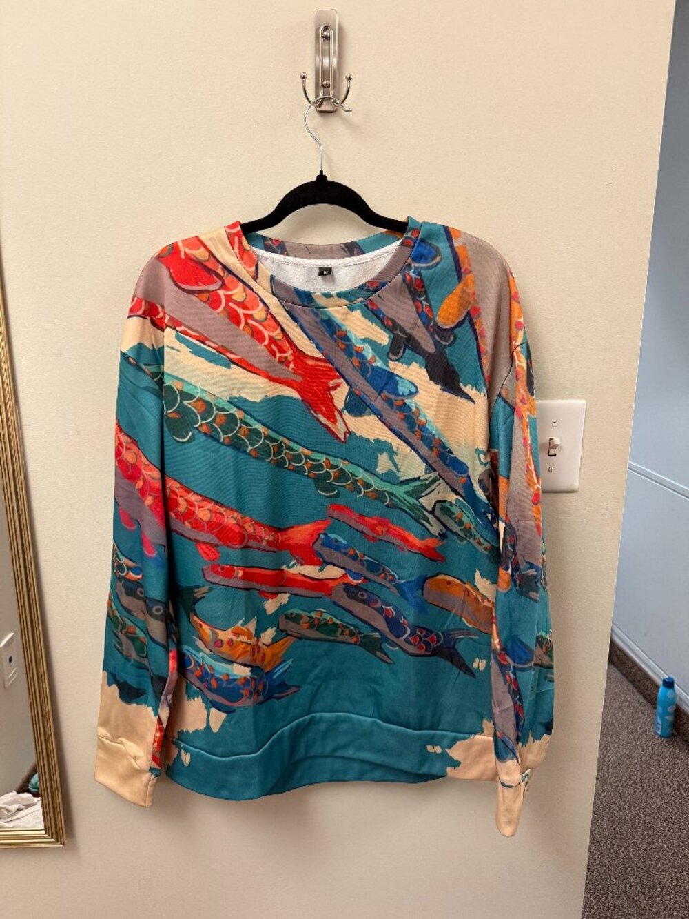 blue crewneck with fish pattern